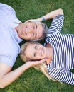 Were closer than ever. High angle portrait of a mature couple lying in the park.