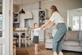 Were definitely two of a kind. a mother dancing with her daughter at home.