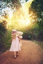 Were going on our own path. a unrecognizable little girl walking with her teddy bear in the middle of a dirt road. Royalty Free Stock Photo