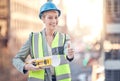 Were good to go. Cropped portrait of an attractive female construction worker giving thumbs up while standing on a Royalty Free Stock Photo