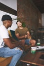 Were great business partners and even better friends. two men laughing while sitting together in a coffee shop. Royalty Free Stock Photo