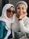 Were having such a good time. Cropped portrait of two affectionate young girlfriends having coffee together at a cafe Royalty Free Stock Photo