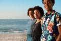 Were in this life together. Portrait of an attractive young trio of women standing together and posing on the beach Royalty Free Stock Photo