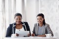 Were making great progress. Cropped portrait of two attractive young businesswomen working together behind a desk in Royalty Free Stock Photo