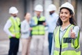 Were making progress. a young female architect showing a thumbs up at a building site. Royalty Free Stock Photo