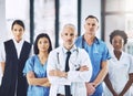 Were serious about healthcare. Cropped portrait of a handsome mature male doctor standing with his arms folded with his