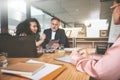 Were the team behind the ideas. two businesspeople sitting together in the office and having a discussion while using a Royalty Free Stock Photo