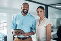 Were the team that create opportunities. two businesspeople standing together in the office and using a tablet. Royalty Free Stock Photo