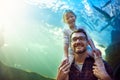 Were thinking of getting some pet fish now. Portrait of a father and his little daughter enjoying an outing to the Royalty Free Stock Photo