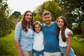 Were a tight-knit family. Cropped portrait of a young family of four standing outside.