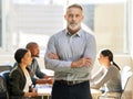 Were about to begin. Cropped portrait of a handsome mature businessman standing with his arms crossed in the boardroom Royalty Free Stock Photo