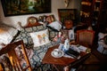 Wernigerode, Saxony-Anhalt, Germany, 29 October 2022: interiors of Kleinstes Haus, Folklore Museum, sofa with cushions and table