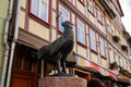 Wernigerode, Saxony-Anhalt, Germany, 29 October 2022: Statue of a hen or rooster, Historic old vintage colored timber frame