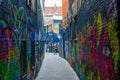 Werregarenstraat Graffiti Street in Ghent, Belgium, Europe, with defocused background with a person on a bike. Colorful famous Royalty Free Stock Photo