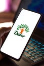 West Bangal, India - October 09, 2021 : Dabur logo on phone screen stock image.