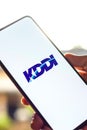 West Bangal, India - October 09, 2021 : KDDI logo on phone screen stock image.