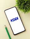 West Bangal, India - October 09, 2021 : KDDI logo on phone screen stock image.