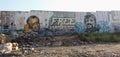 West Bank barrier with murals of Palestinian leaders