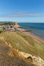 West Bay Dorset uk view to east of the Jurassic coast on a beautiful summer day with blue sky Royalty Free Stock Photo