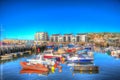 West Bay harbour Dorset UK boats on calm blue sky summer day Royalty Free Stock Photo