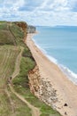 08-29-2020 West Bay, UK. Family enjoying walking on top of Jurassic Cliffs on sunny summer day. Royalty Free Stock Photo