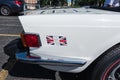 Rear quarter panel of a white Triumph TR6