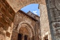 West face wall with columns entrance of church Eglise Saint-Pierre de Carennac decorated with medieval tympanum Royalty Free Stock Photo