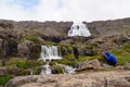 Unidentified tourist taking picture of Dynjandi Waterfall,Iceland.