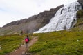 Unidentified tourist walking to Dynjandi Waterfall,Iceland.