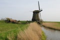 Windmill next to a canal in West Friesland, Netherlands.