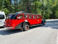 A vintage looking tour bus in Glacier National Park near Lake McDonald and Apgar Campground Royalty Free Stock Photo