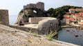 West Harbor with Lovrijenac Fort, view from the old town wall with Pile Gate tower in the foreground, Dubrovnik, Croatia Royalty Free Stock Photo