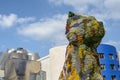 A West Highland terrier carpeted in bedding plants, Puppy . Bilbao , Spain