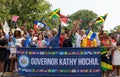 West Indian Labor Day Parade. Al Sharpton, Kathy Hochul, and Stacey E Plaskett walking with people.