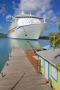 West Indies, Caribbean, Antigua, St Johns, Colourful building & Cruise Ship in Port