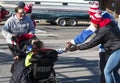 Kids in stroller get high fives at end of a local thanksgiving r Royalty Free Stock Photo