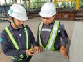 West Java, Purwakarta - June 10, 2023: Workers take measurements on concrete using a meter