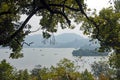 West Lake Xi Hu in Hangzhou, Zhejiang Province, China. View through the trees towards Leifeng Pagoda.