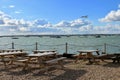 West Mersea estuary with seagull bobbing boats Royalty Free Stock Photo