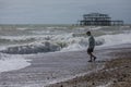 West Pier, Brighton, England - the waves and a guy. Royalty Free Stock Photo