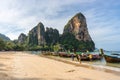 Tourists land in the morning from a Thai long-tail boat on an