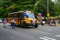 West Seattle Grand Parade, modern school bus decorated with balloons and welcome back sign