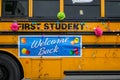 West Seattle Grand Parade, modern school bus decorated with balloons and welcome back sign