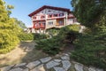 The west side of Villa Arnaga in Cambo-les-Bains, as seen from the park walk pass, typical house of neo Basque style in French