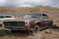 Wrecked abandoned muscle car in desert