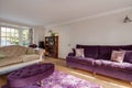 Purple sofa and footstool