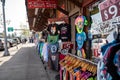 T-shirt store having a sidewalk sale, selling cheap clothing from Yellowstone