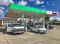 West Yellowstone, Wyoming - July 9, 2019: Sinclair gas station with green colors and cars refueling