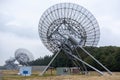 Westerbork Synthesis Radio Telescope surrounded by forests under a cloudy sky in the Netherlands