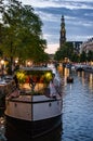 Westerkerk and Houseboat at Sunset in Amsterdam Royalty Free Stock Photo